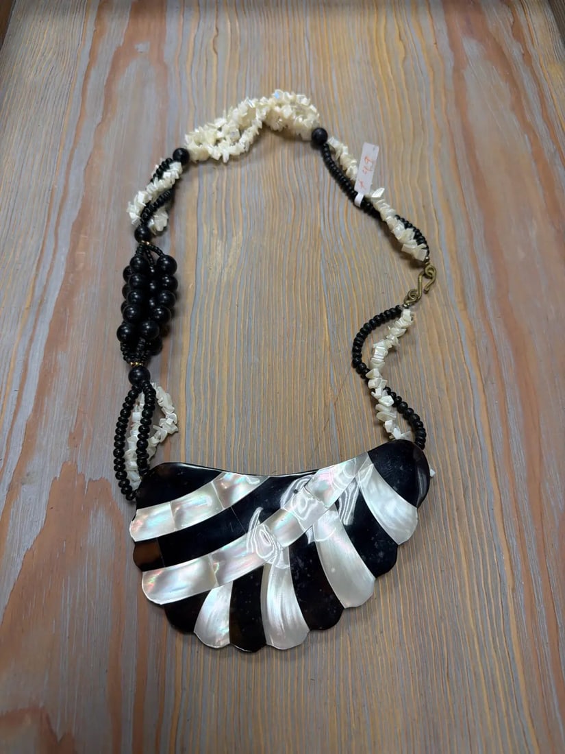 Mother-of-Pearl & Horn Bib 20" Length, HD46: Fan-shaped pendant with inlaid shell and dark horn on bead strands.