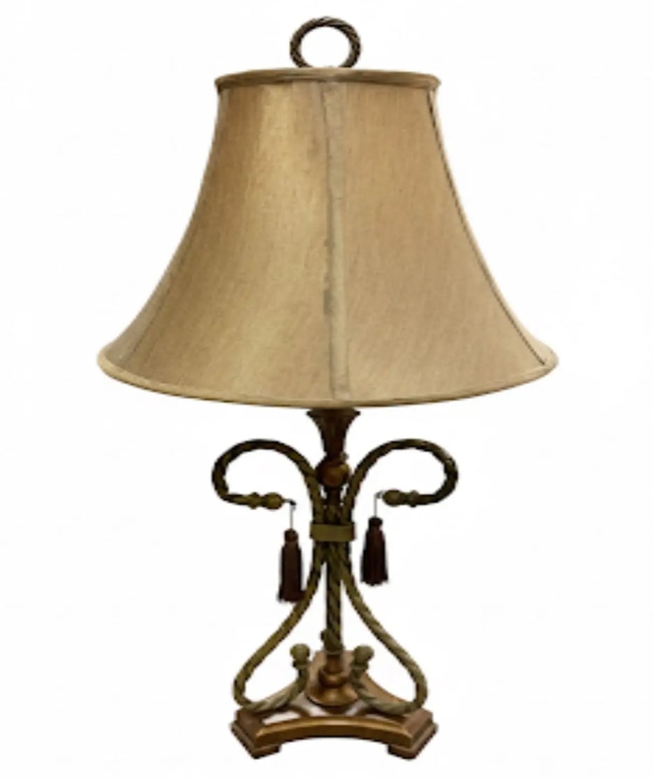 Ornate Antique Table Lamp Traditional lamp with a twisted metal base, tassels, and beige fabric (1 of 1)