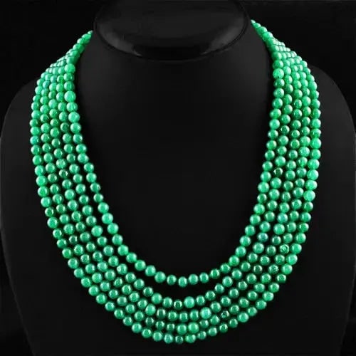 Exceptional Quality 522.95 CTS EARTH MINED RICH GREEN EMERALD 5 LINE ROUND BEADS NECKLACE - ON SALE: AAA+ Quality 522.95 Cts Earth-Mined Green Emerald 5-Strand Beaded Necklace Product Details: Gemstone: Natural Emerald (Earth-Mined) Total Weight: Approx. 522.95 Carats Bead Shape: Round Strands: 5 Str