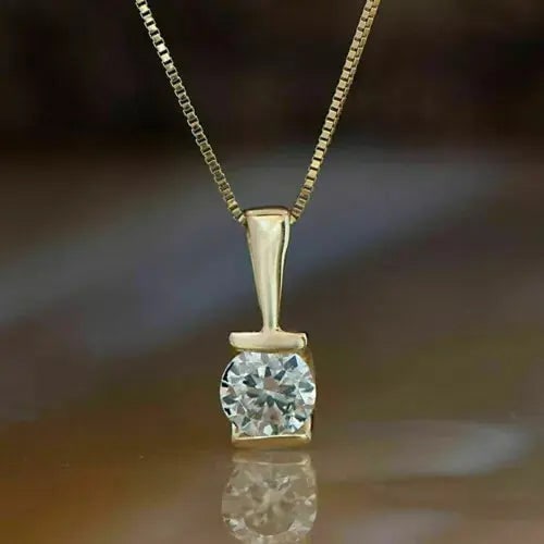 Exceptional Quality 1.5Ct Round Cut Diamond Solitaire Pendant 14K Yellow Gold Finish Free Chain: Our gemstones are organic, natural stones suitable for investment, collectors, and fine jewelry, each accompanied by an authentic certification. Our 925 silver pieces are rhodium-plated and finished w