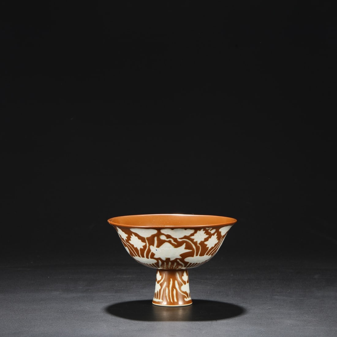 A PURPLE-GOLD GLAZED 'FISH AND WEEDS' STEM BOWL: A PURPLE-GOLD GLAZED 'FISH AND WEEDS' STEM BOWL Dimensions: Height: 11 cm (4.3 in.), Mouth Diameter: 16 cm (6.3 in.). All measurements are approximate.