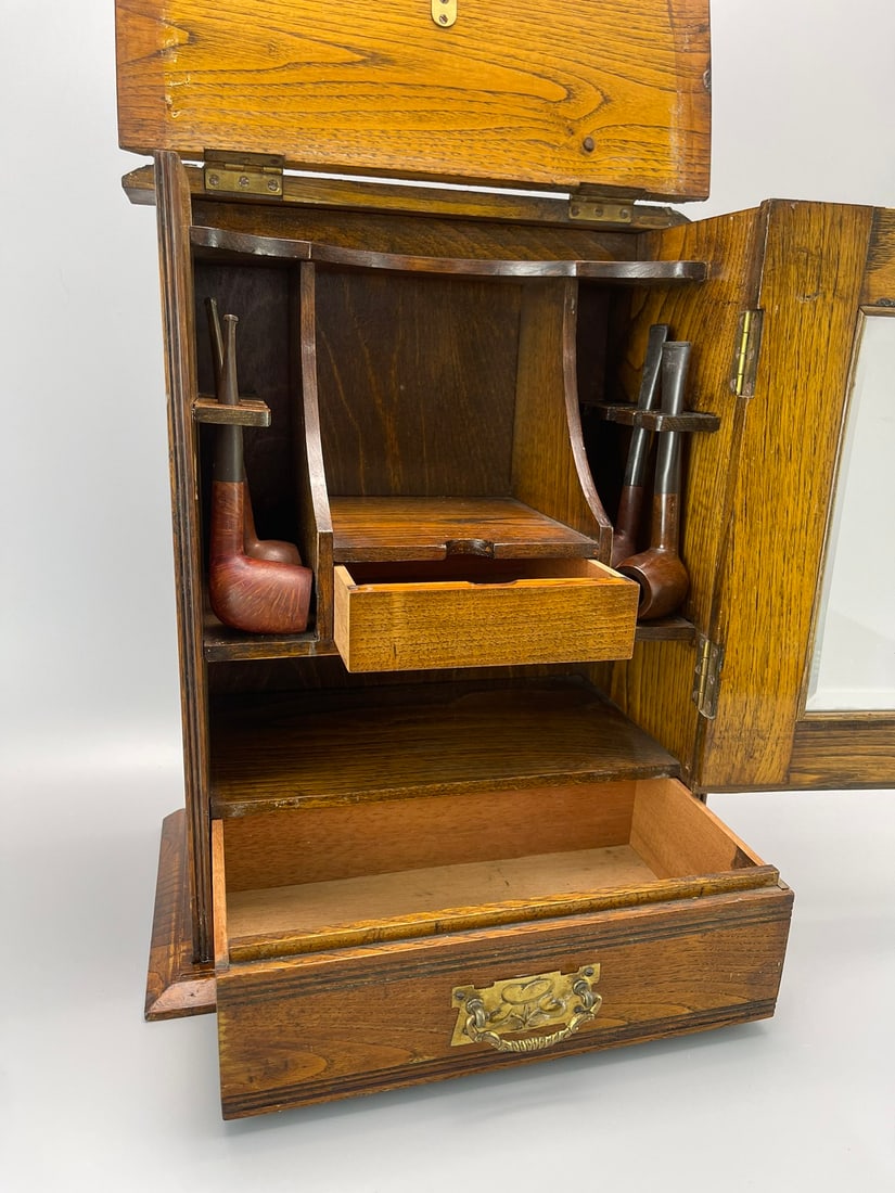 A SOLID OAK PIPE CABINET, 1925 - 5