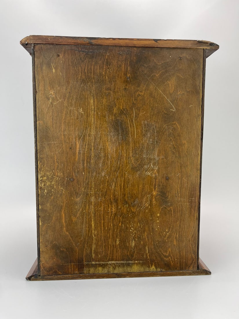 A SOLID OAK PIPE CABINET, 1925 - 7