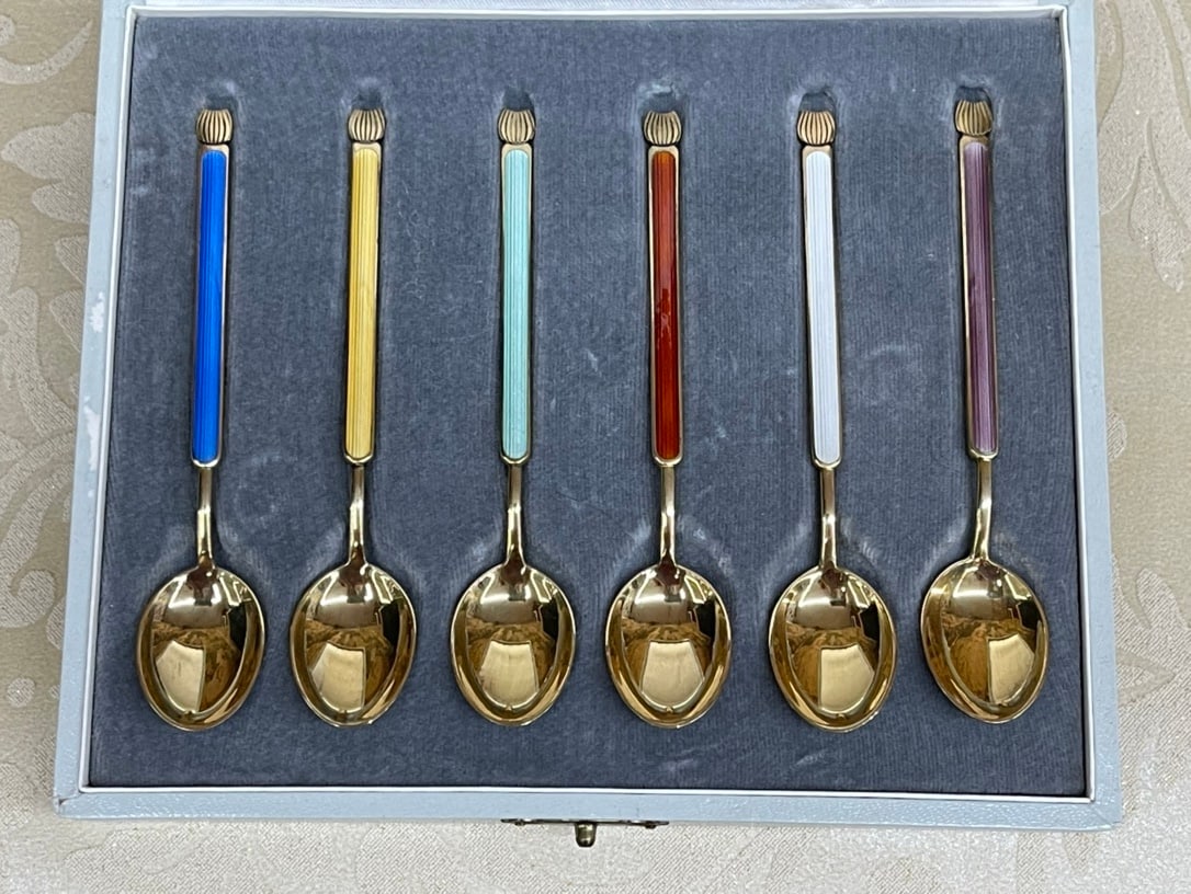A SET OF DANISH ANTON MICHELSEN STERLING SILVER-GILT AND ENAMEL COFFEE AND CAKE SPOONS (1 of 2)