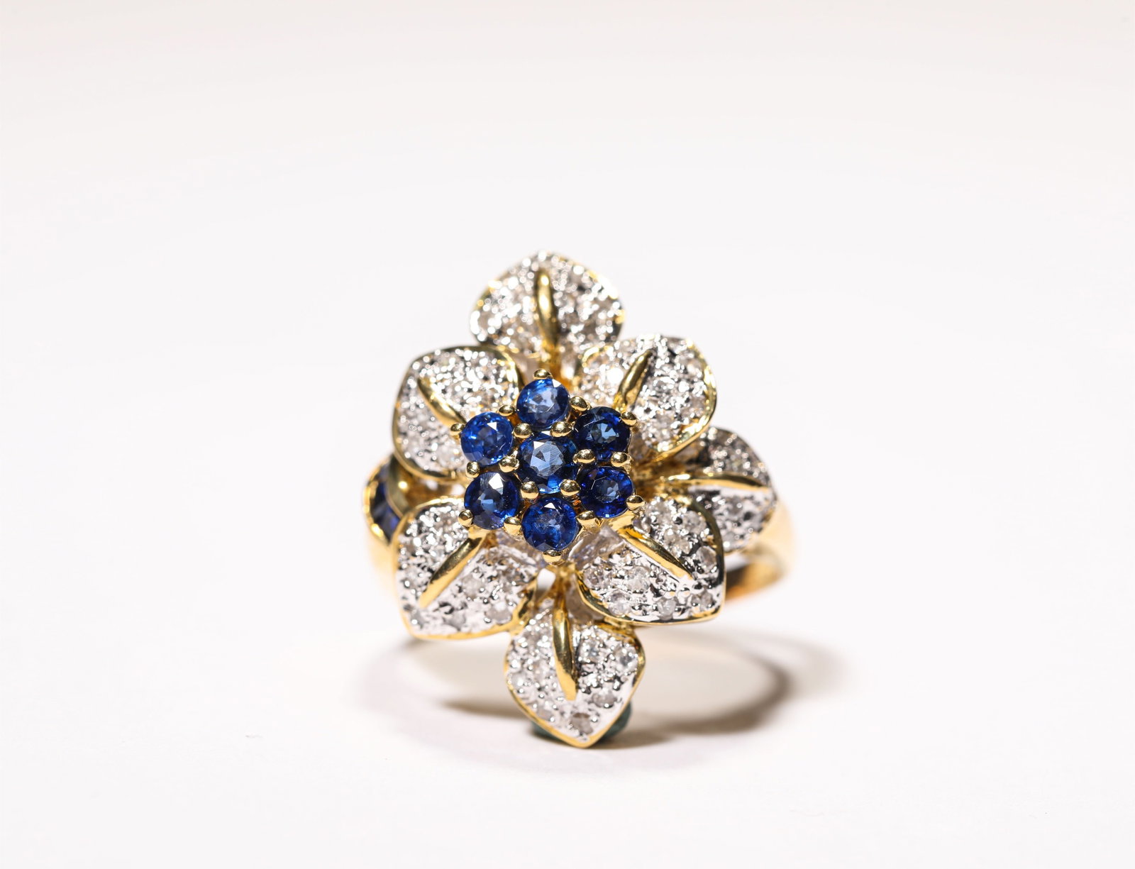 A GOLD SAPPHIRE AND DIAMOND RING: A GOLD SAPPHIRE AND DIAMOND RING Weight: 9 g, Ring Size: 1.8 cm (0.7 in.), Width: 1.9 cm (0.7 in.), Height: 2.4 cm (0.9 in.). All measurements are approximate.