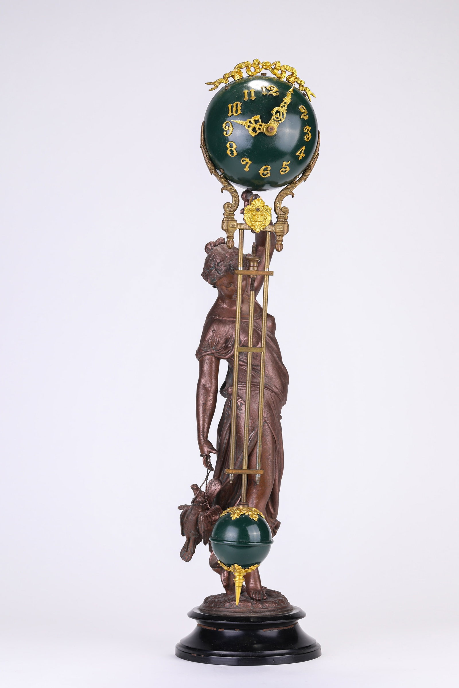 AN AMERICAN ANSONIA 'FIGURE STATUE' SWINGING CLOCK: AN AMERICAN ANSONIA 'FIGURE STATUE' SWINGING CLOCK Weight: 5.5 kg, Length: 15 cm (5.9 in.), Height: 59.5 cm (23.4 in.). All measurements are approximate.