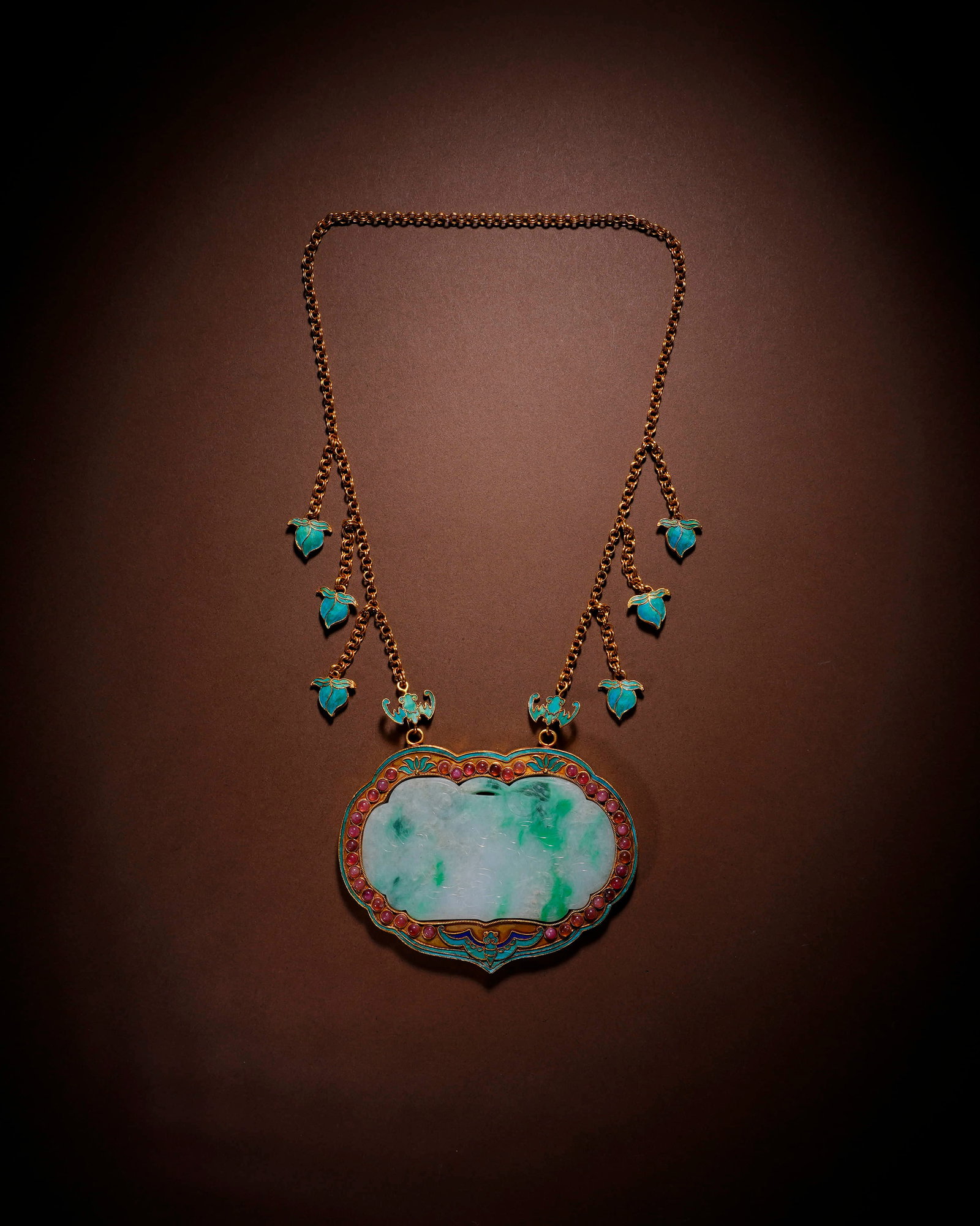A JADEITE LONGEVITY LOCK PENDANT: A JADEITE LONGEVITY LOCK PENDANT Length: 10.5 cm (4.1 in.), Height: 8 cm (3.1 in.). All measurements are approximate.