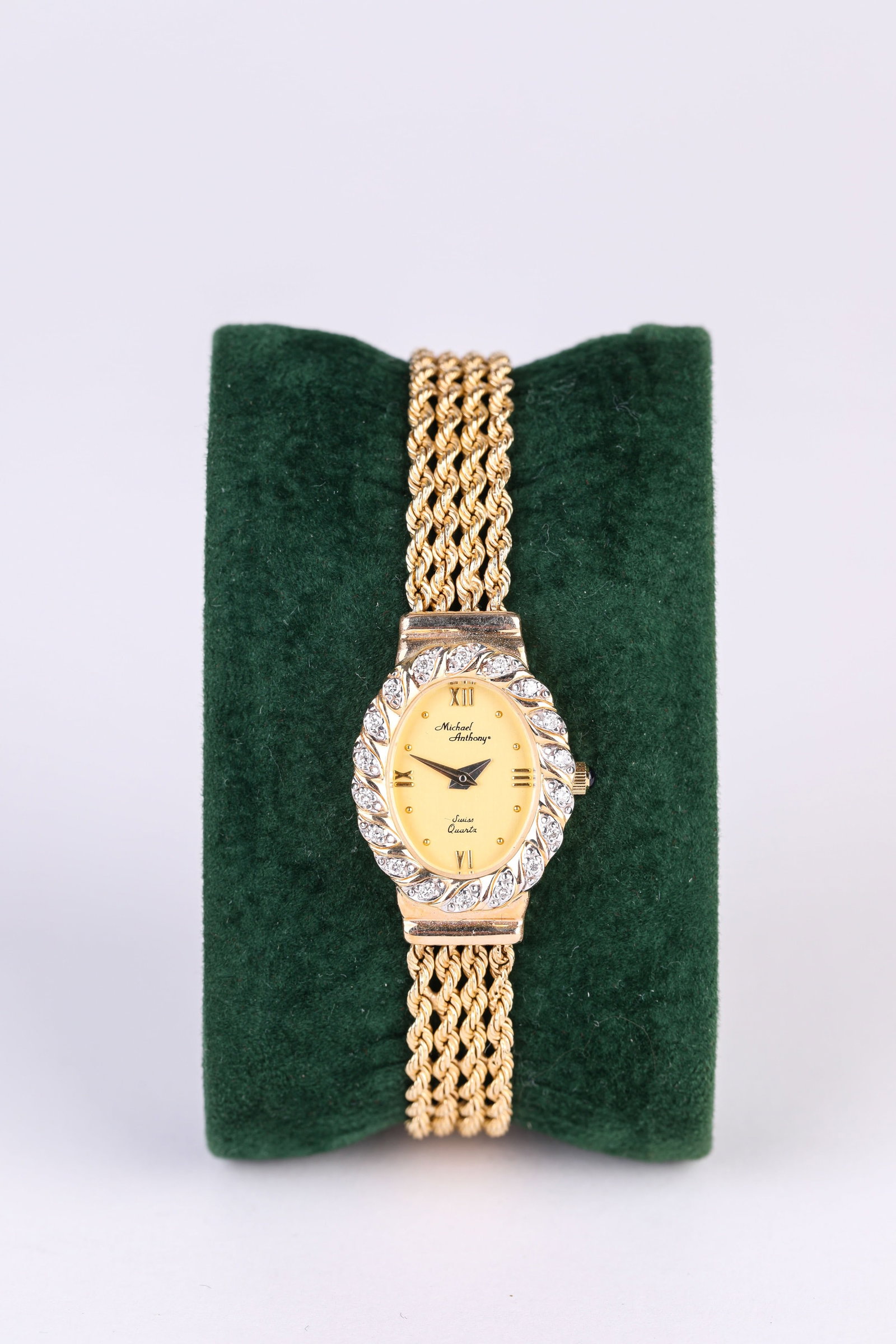 A MICHAEL ANTHONY GEM-SET GOLD POCKET WATCH CHAIN: A MICHAEL ANTHONY GEM-SET GOLD POCKET WATCH CHAIN Width: 2.1 cm (0.8 in.), Height: 2.9 cm (1.1 in.). All measurements are approximate.