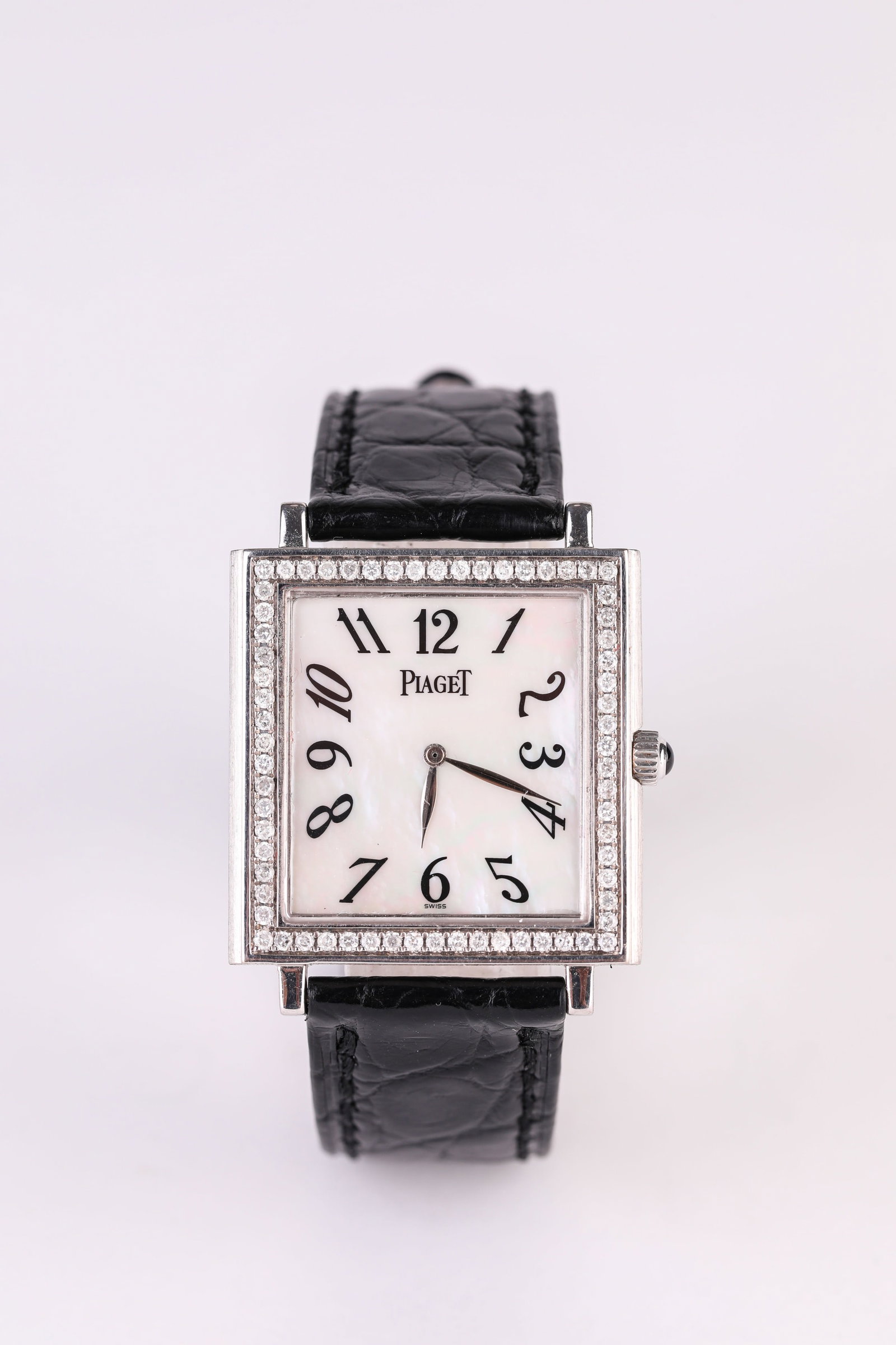 A PIAGET GOLD DIAMOND WATCH: A PIAGET GOLD DIAMOND WATCH Width: 3.1 cm (1.2 in.), Height: 2.9 cm (1.1 in.). All measurements are approximate.