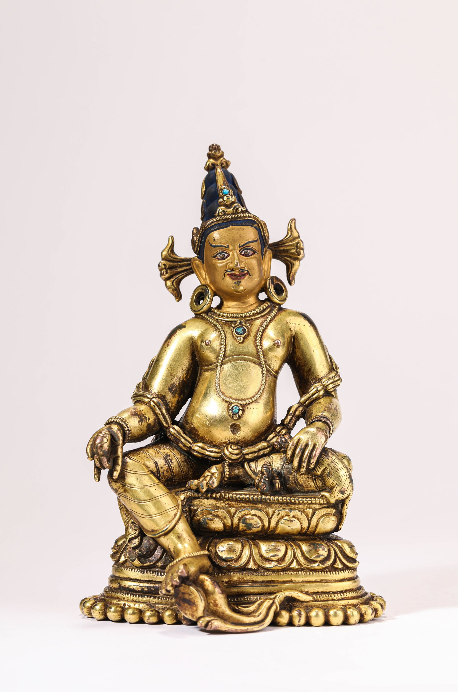 A YELLOW JAMBHALA FIGURE (1 of 6)