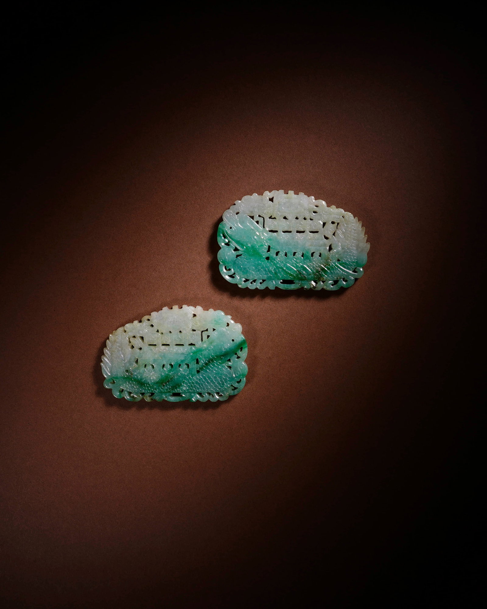 A SET OF JADEITE OPENWORK PLAQUES: A SET OF JADEITE OPENWORK PLAQUES Item 1: Length: 7.8 cm (3.1 in.), Height: 5.1 cm (2.0 in.); Item 2: Length: 7.8 cm (3.1 in.), Height: 5.2 cm (2.0 in.). All measurements are approximate.