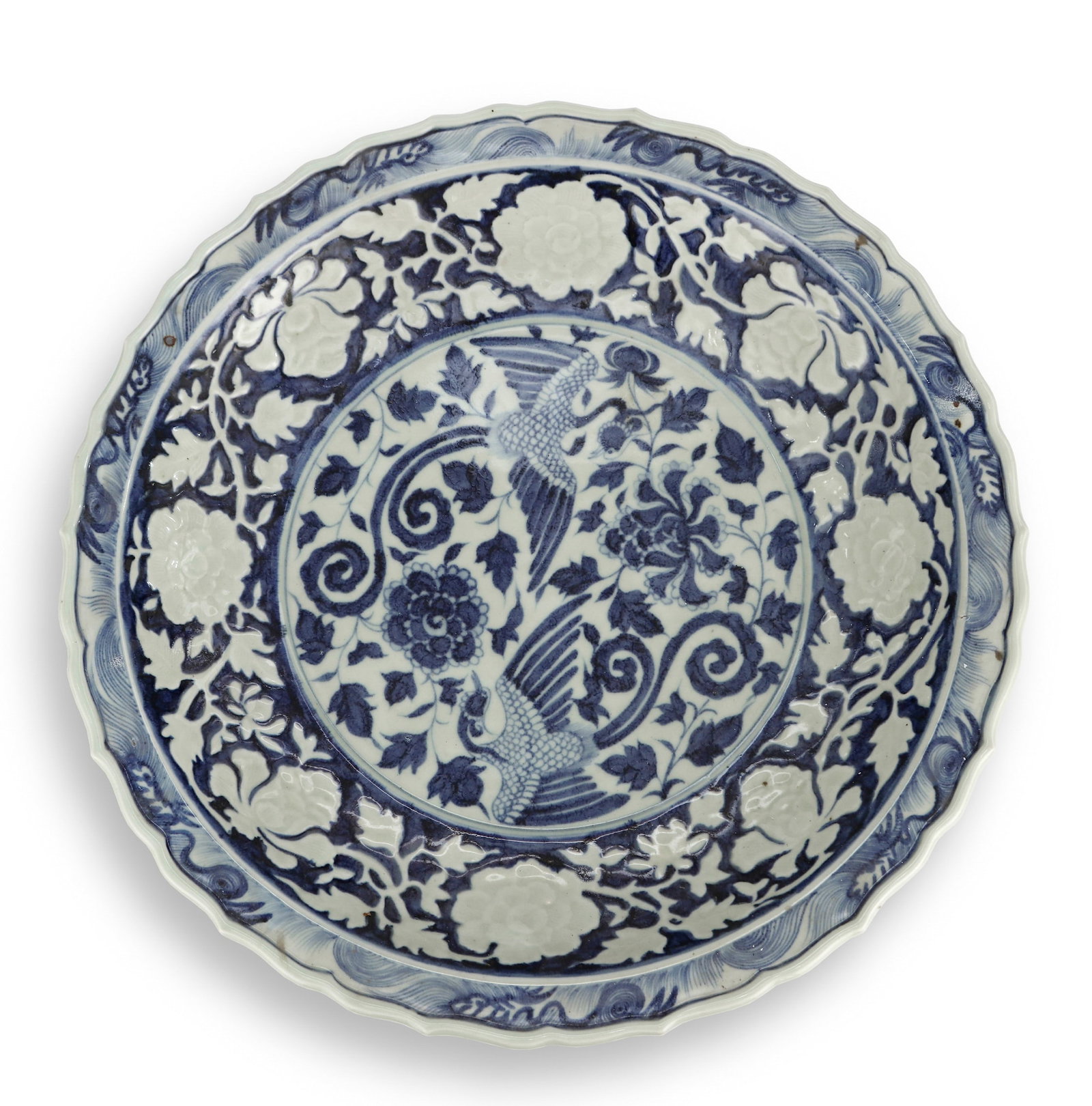 A BLUE AND WHITE RESERVED 'FLOWERS AND BIRDS' DISH: A BLUE AND WHITE RESERVED 'FLOWERS AND BIRDS' DISH Diameter: 44.5 cm (17.5 in.). All measurements are approximate.
