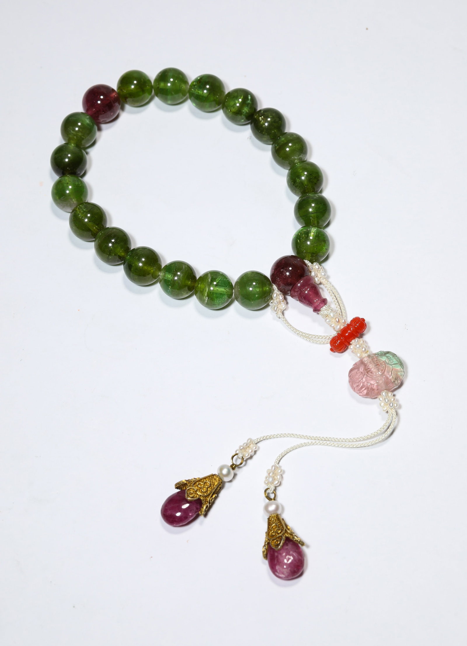 A TOURMALINE EIGHTEEN-BEAD WRIST BRACELET (1 of 5)
