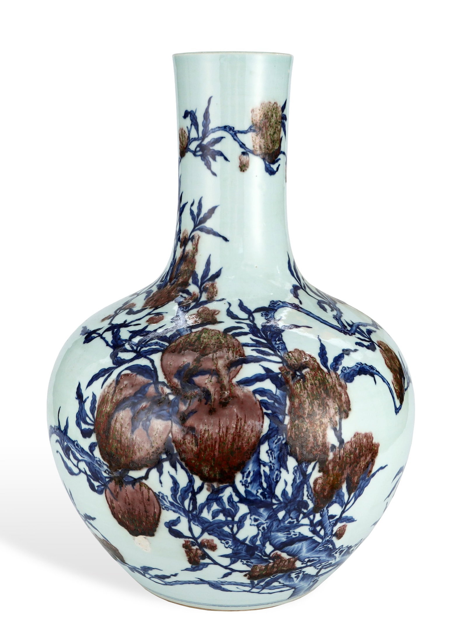 A BLUE AND WHITE WITH COPPER-RED 'PEACH OF LONGEVITY' CELESTIAL VASE: A BLUE AND WHITE WITH COPPER-RED 'PEACH OF LONGEVITY' CELESTIAL VASE Length: 37.5 cm (14.8 in.), Height: 55.5 cm (21.9 in.). All measurements are approximate.