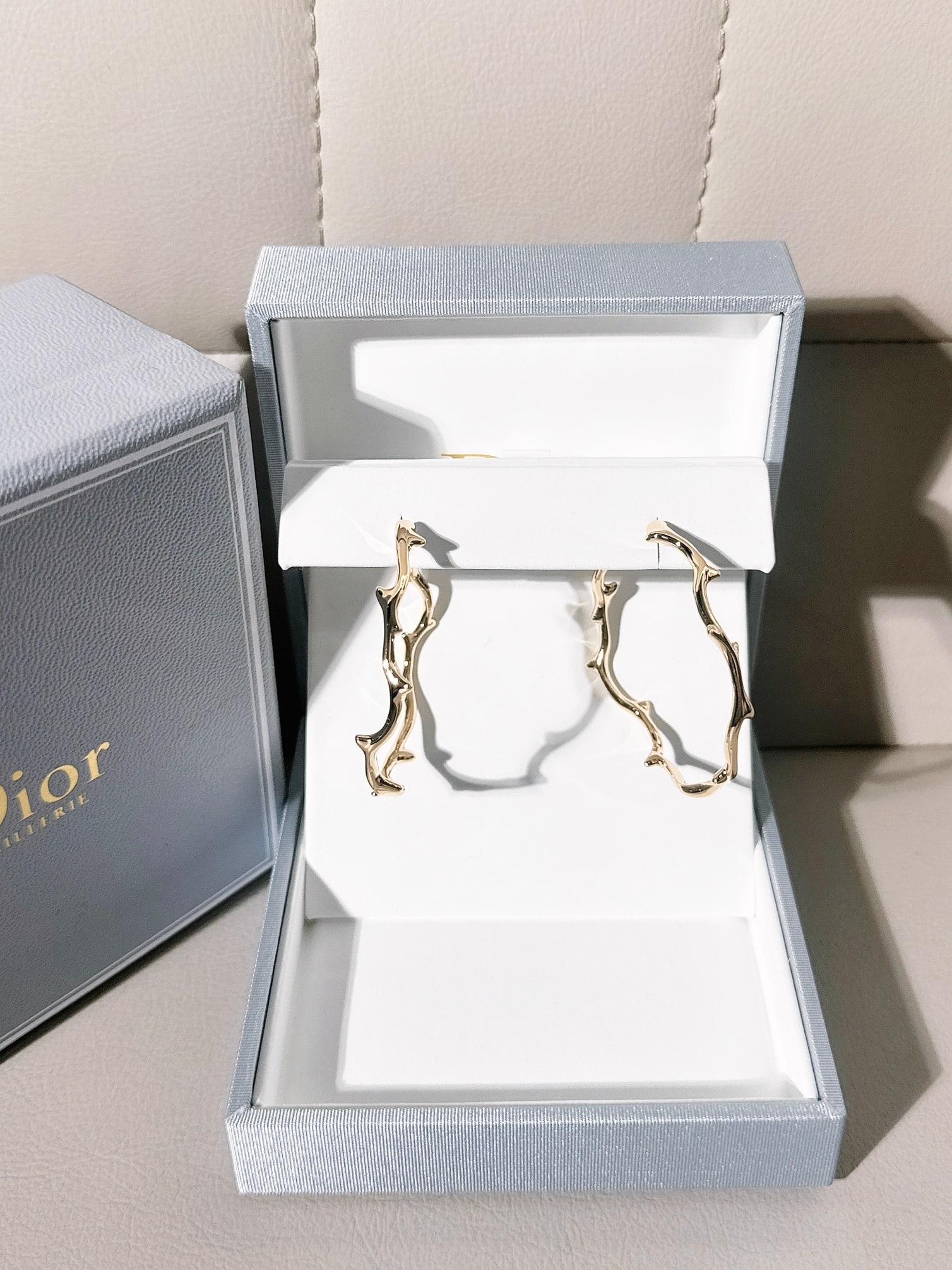 Dior "Bois de Rose" Hoop Earring 18K Yellow Gold Fashion Earring: esign Details: The Dior Bois de Rose collection is defined by a stylized, abstract reinterpretation of a rose stem in 18k gold (yellow, rose, or white).Visual Match: Large hoop models from Dior featur