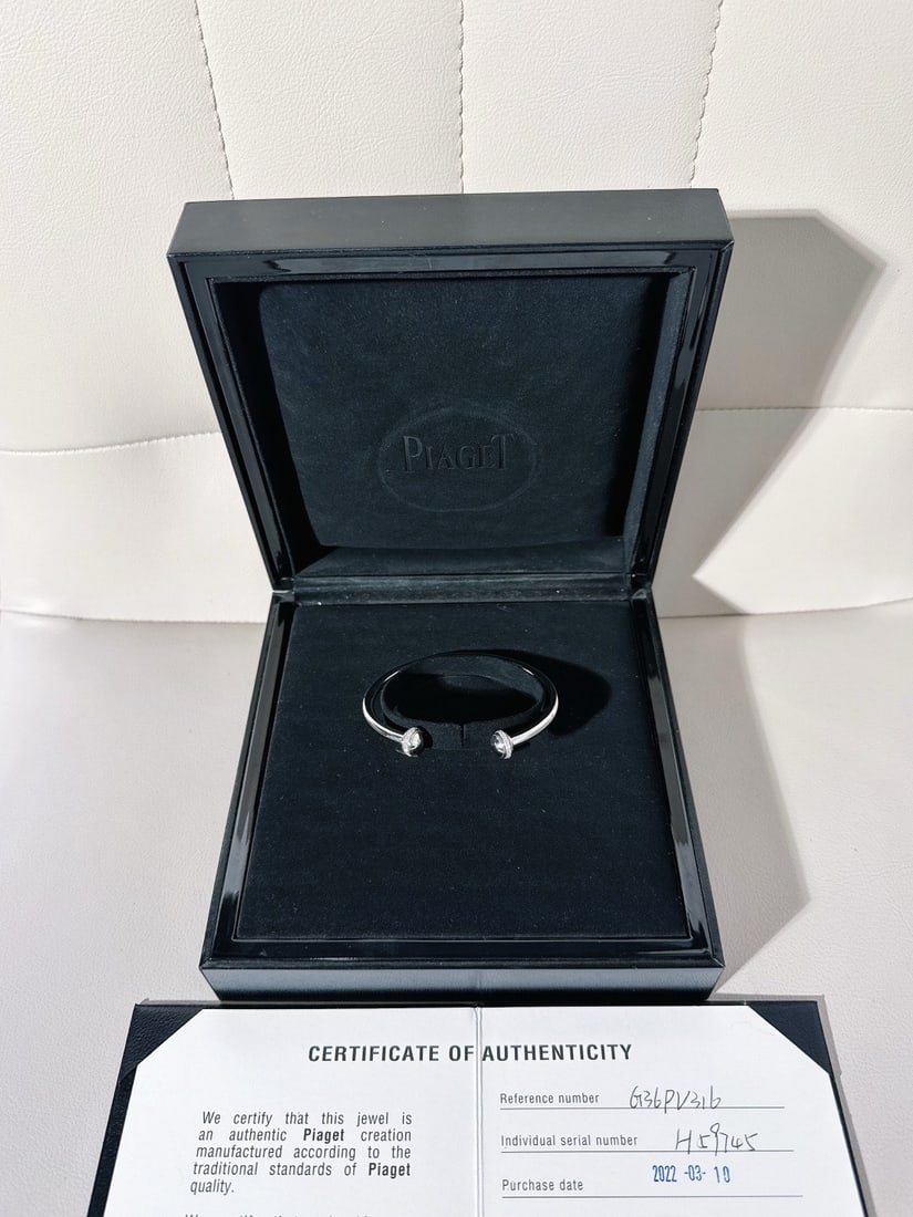 Piaget Possession 18K White Gold Diamonds Open Bangle Bracelet Size 16: Piaget Possession Open Bangle Bracelet, typically crafted from 18K white gold and adorned with brilliant-cut diamonds on its rotating end caps.The "Possession" collection is iconic for its turning ban