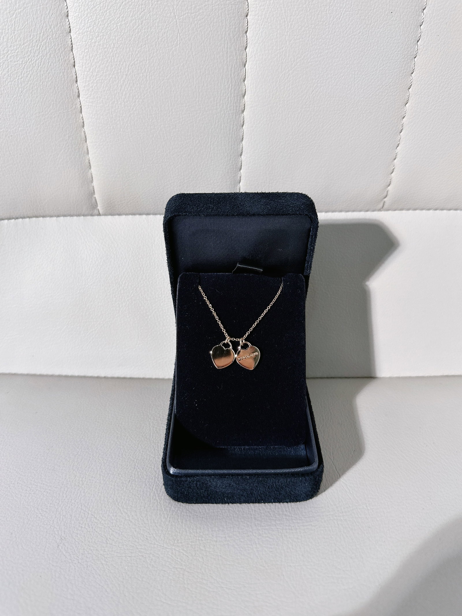Tiffany 18k rose gold Double Heart Tag Pendant: Tiffany Double Heart Tag Pendant from the renowned luxury jeweler Tiffany & Co..Design DetailsThe piece is part of a collection inspired by an iconic 1969 Tiffany keyring. This specific version featur