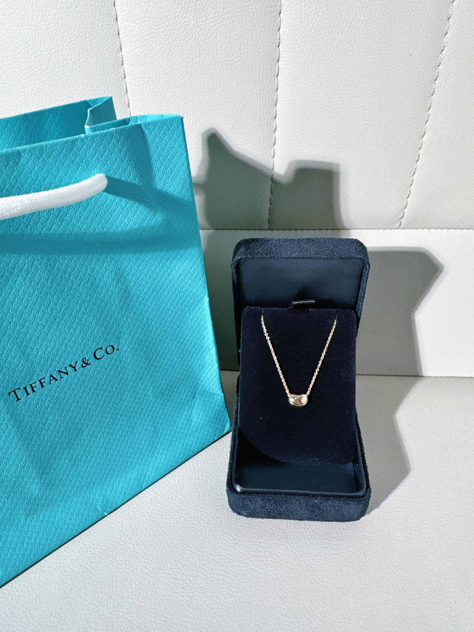 Tiffany 3.4g 9mm 18k Gold Bean Pendant Necklaces: Elsa Peretti Bean design pendant by Tiffany & Co.. The bean motif is a hallmark of Elsa Peretti's work, symbolizing life's origins through its organic, sculptural form.Classic style, 9mm pea-sized, cu