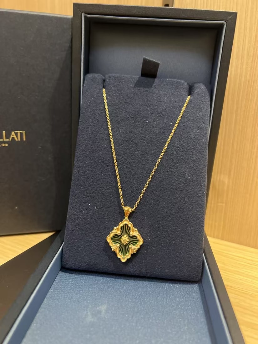 Buccellati Opera Tulle 18k Yellow Gold Green Enamel Pendant: Opera Tulle Pendant by the luxury Italian jeweler Buccellati.The piece features the brand's iconic logo motif, crafted in 18k yellow gold with a green enamel background. A signature element of this co
