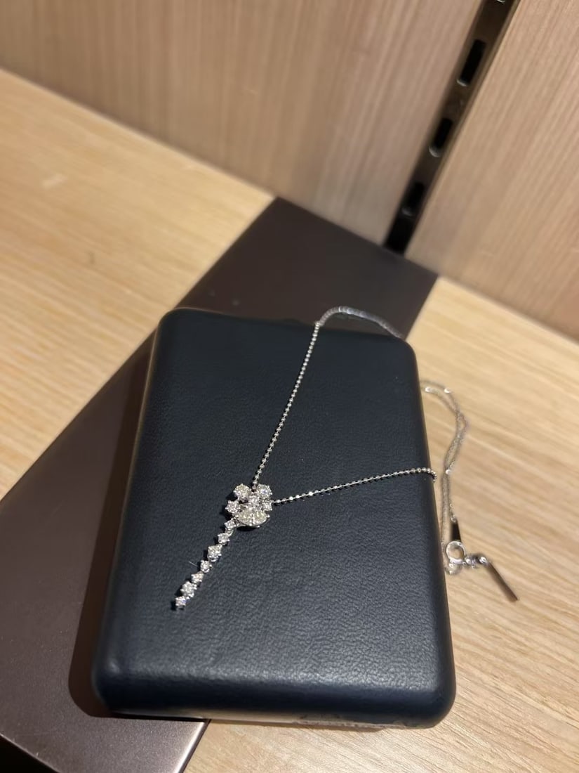 TASAKI Floral Diamond Drop Necklace, Y-Shaped Pendant Design: ASAKI Diamond Necklace.This elegant piece is characterized by a floral-inspired cluster at the center that transitions into a delicate, linear diamond drop.Key Product DetailsBrand: TASAKI.Design: A "
