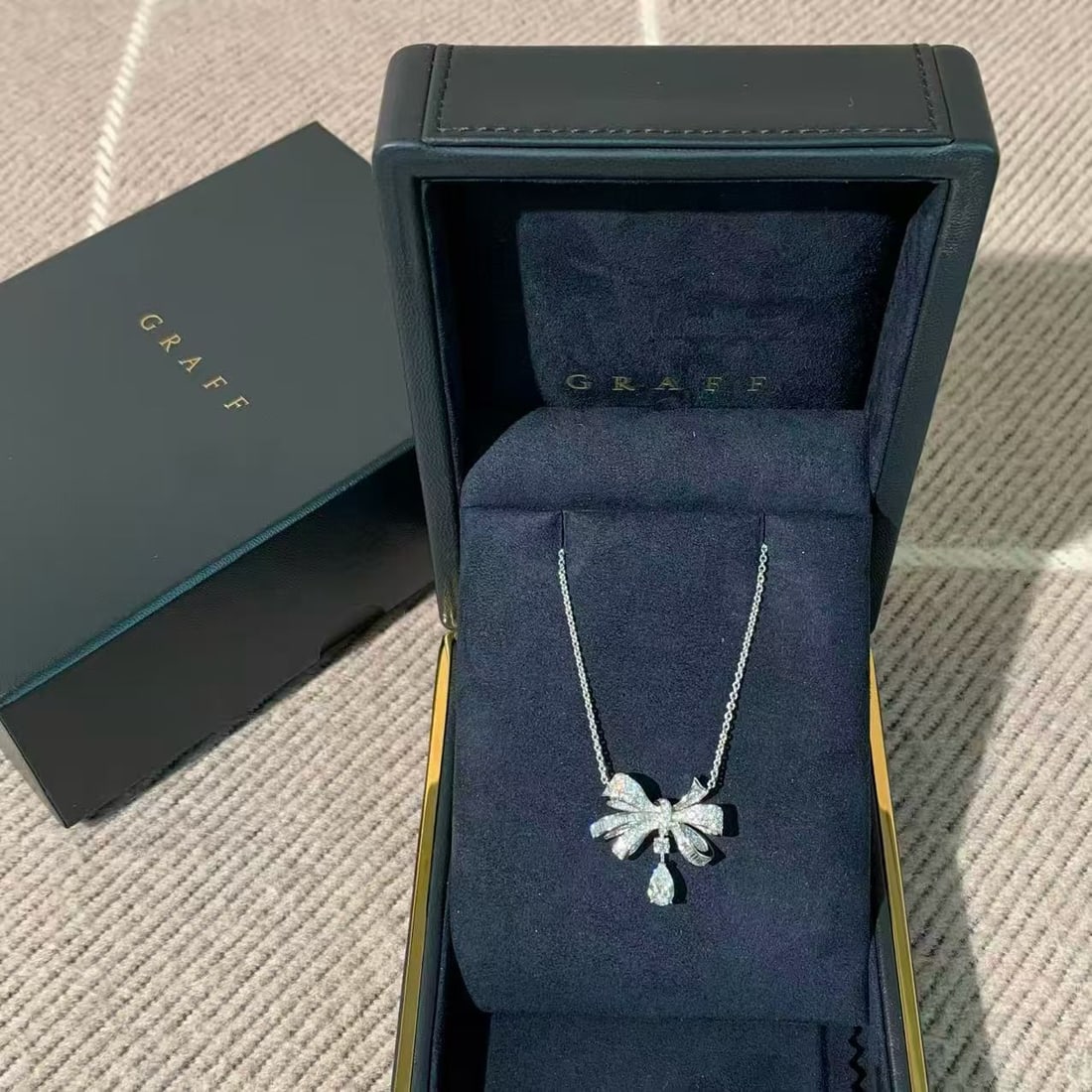 Graff Tilda's Bow Double Pave Diamond Drop Necklace, 18K White Gold: Graff Tilda's Bow Classic Diamond Drop Necklace in 18K White Gold?Center stone: 0.70ct, set with top-tier diamonds.?Featuring the iconic bow design, this piece exudes timeless elegance and boasts exce