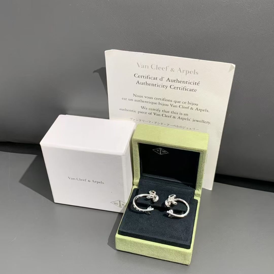 Van Cleef & Arpels Ruban Collection 18K White Gold Full Diamond Bow Earrings: Metal: White GoldPlace of Origin: FrancePeriod: 2010-Date of Manufacture: 2013Condition: Good. In original box.