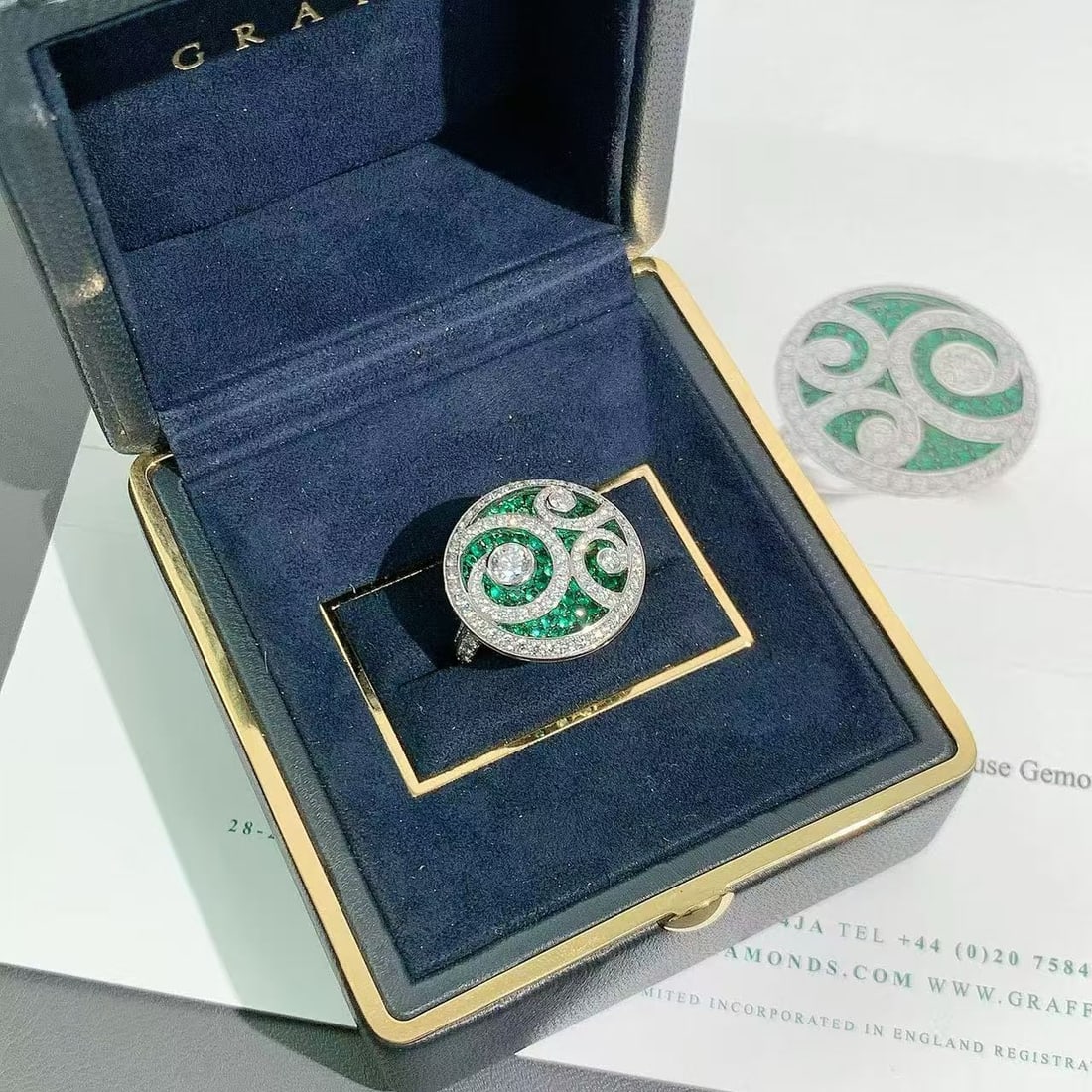 Graff "Diamond on Diamond" cocktail Ring Emeralds Pave-Diamonds White Gold 51: Graff 'Diamond on Diamond' Emerald and Diamond Ring.This distinctive design features a delicate scroll or wave pattern of pave-set round diamonds layered over a "bed" of micro-set circular-cut emerald