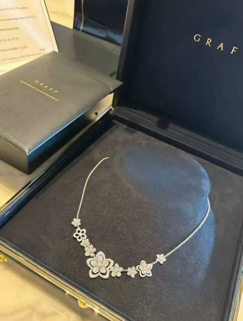 Graff Wild Flower Necklace Full set diamonds 18K white gold: The Wild Flower Multi-Row Diamond Necklace is adorned with uniquely beautiful diamond flowers, arranged in a captivating asymmetric pattern along the collarbone for a dazzling and eye-catching effect.