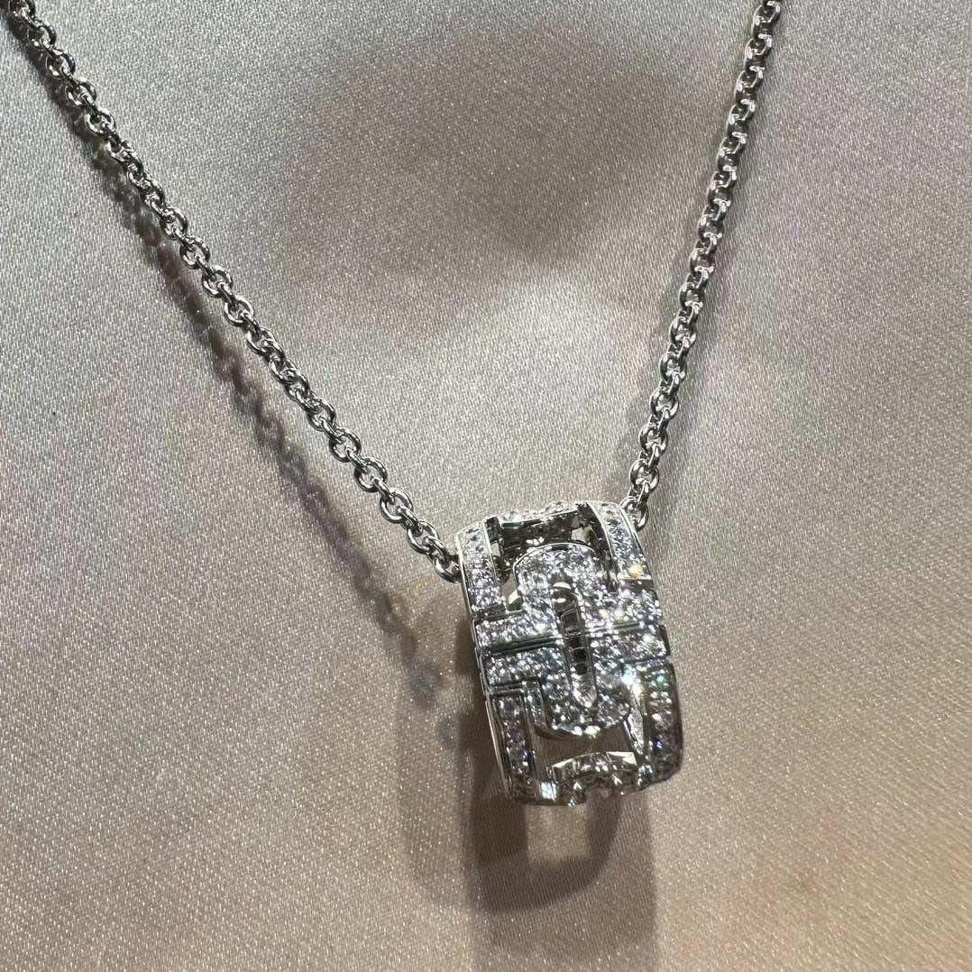 Bvlgari Parentesi Pendant Necklace 18k White Gold: Product DetailsCollection: Parentesi.Material: 18kt White Gold.Gemstones: Round brilliant-cut diamonds in a pave diamond setting.Design: Features interlocking, open-work geometric segments that form a