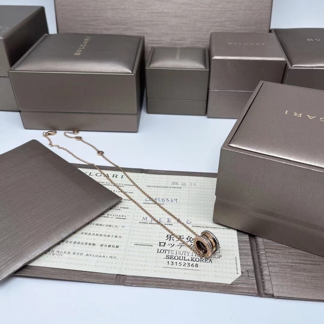 Bulgari Two-Tone Gold Double-Row Diamond 20th Anniversary Spring Necklace: B.zero1 pendant necklace by Bulgari, a signature design inspired by the Roman Colosseum.The pendant features a distinctive spiral structure flanked by two bandKey FeaturesCollection: B.zero1 (introduc
