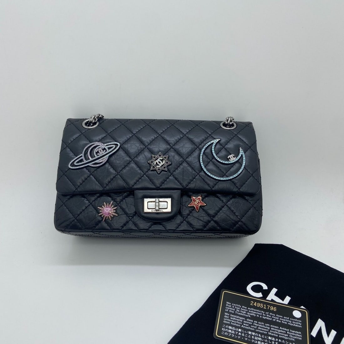 Chanel Space Station 2.55 Reissue Flap Bag Aged Calfskin Planets Charms Black: Minor signs of wear, scratches on hardware, slight chain wear, clean interior and exterior.
