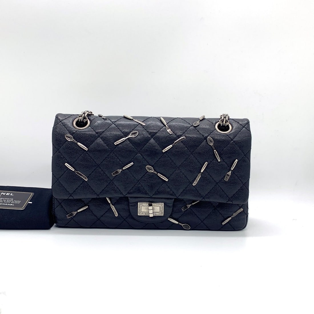 Chanel Brasserie 2.55 Reissue 225 Flap Bag Black Utensil Charms Rare: Normal signs of wear, slight scuffs on the four corners, scratches on the hardware, clean inside and out.