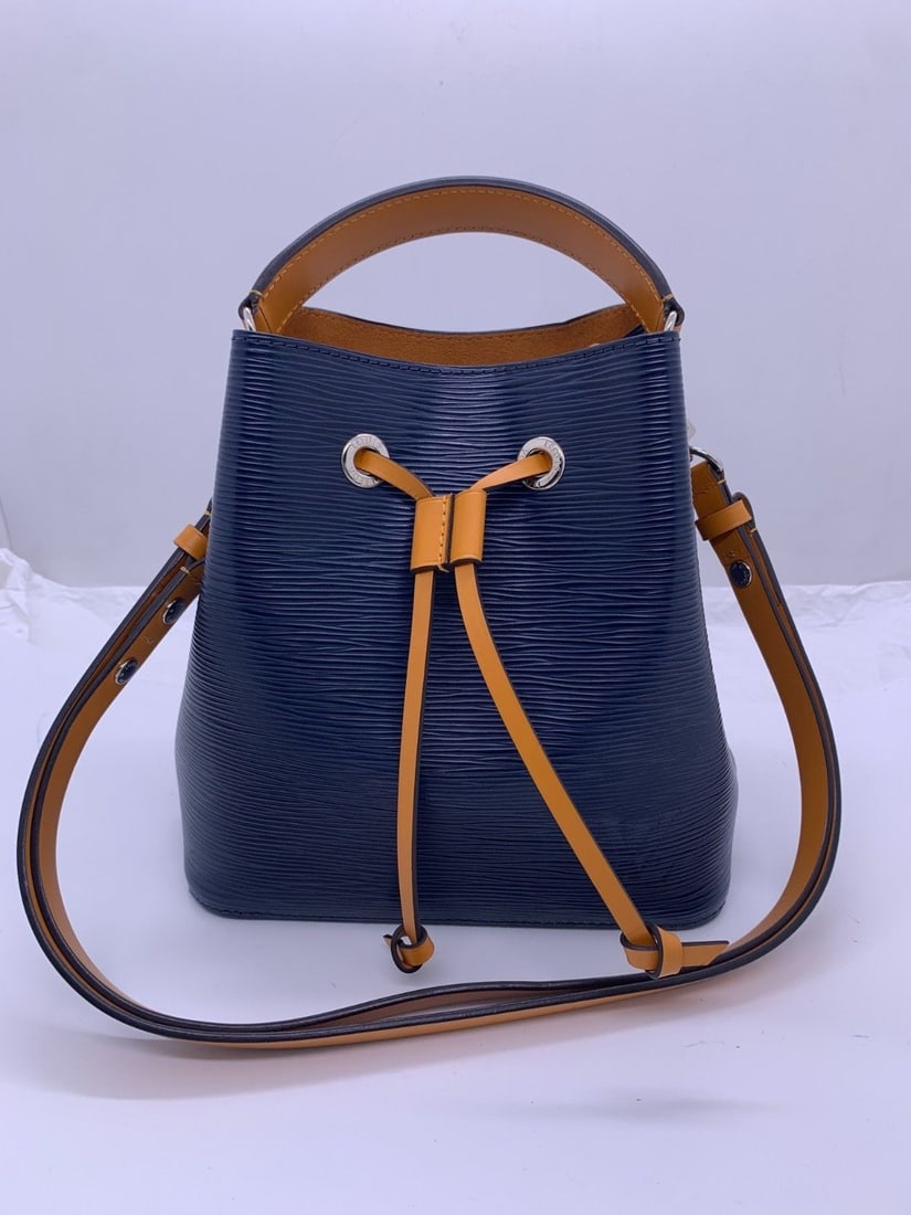 LOUIS VUITTON Neonoe BB Epi Leather Indigo Safran Bucket Shoulder Bag France: It shows normal signs of use, with scuffs on the four corners, scratches on the hardware, and a clean interior.