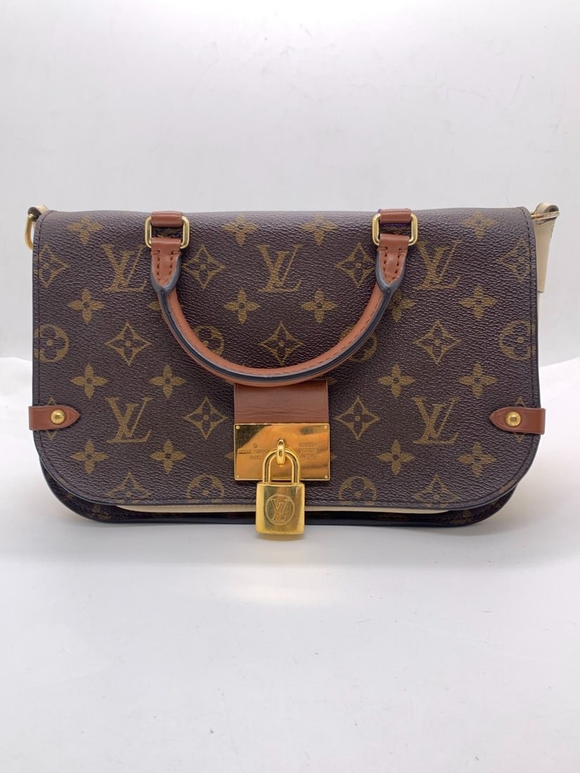 Louis Vuitton Monogram Canvas Vaugirard Top Handle Crossbody Bag Origin Spain: Normal signs of use, wear on the four corners, damaged surface leather with small-area stains, scratches and color fading on the hardware.