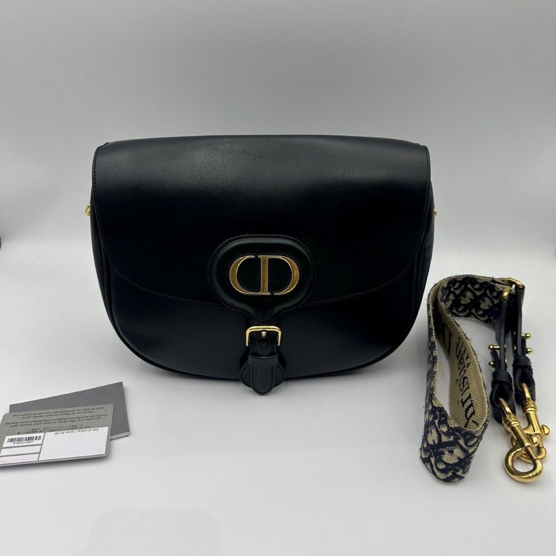 Dior Bobby Bag Black Leather Large shlouder bag Origin Italy: The condition is very average, the leather surface has scratches, the hardware has scratches, there are traces of use inside, the oil edge has come off, the strap has come undone (as shown in the pict
