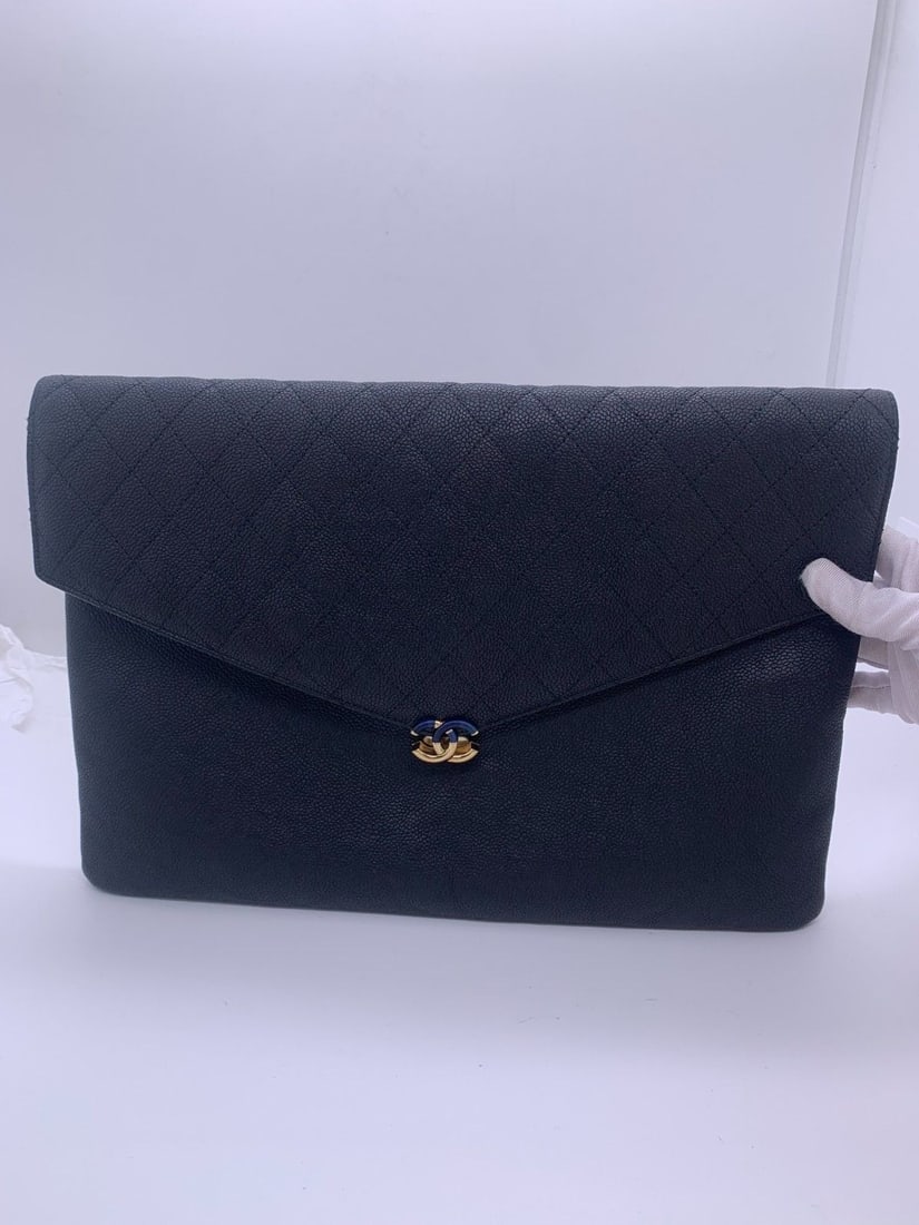 Chanel Black Quilted Litchi Grain Lambskin Envelope Clutch Gold CC Logo Italy: Normal signs of use, worn corners, scratched hardware, clean interior.