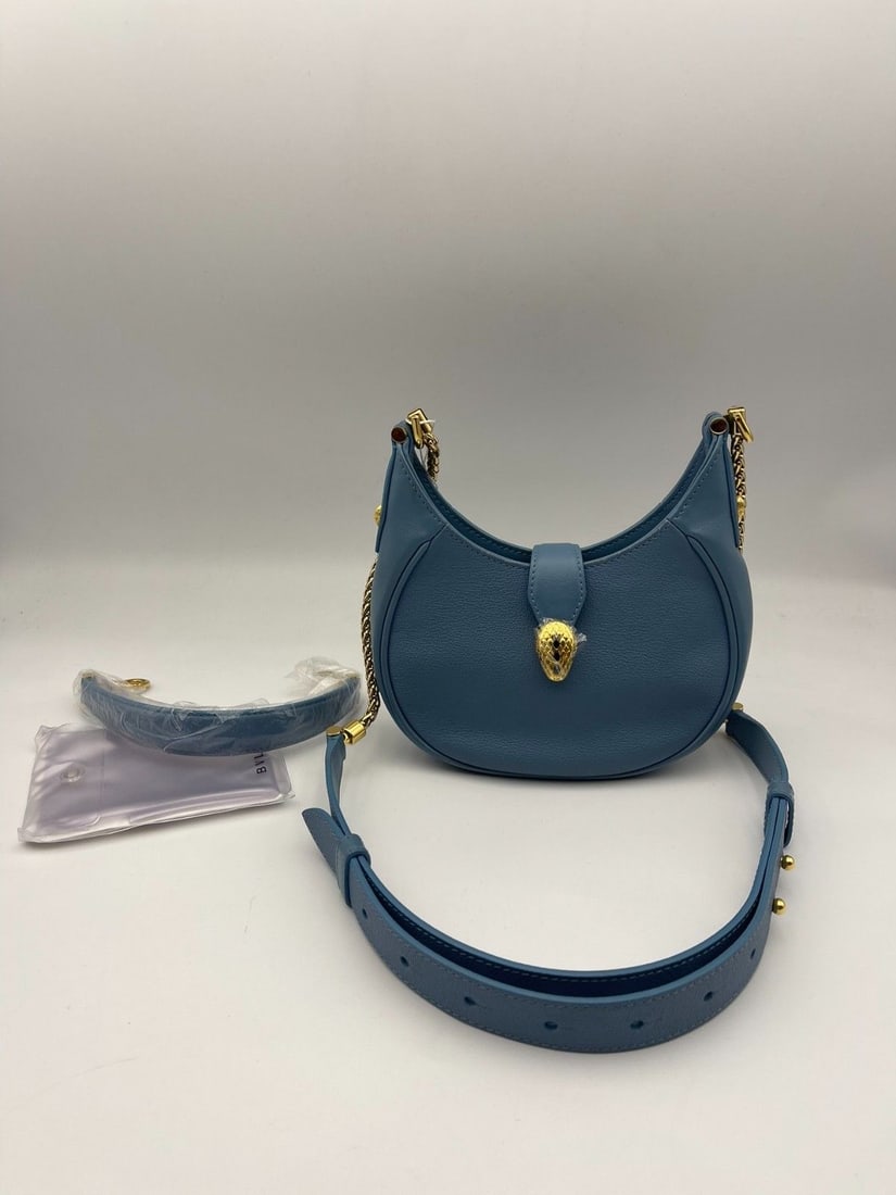 BVLGARI Blue Serpenti Ellipse Hobo Bag Shoulder crossbody Women Handbag Italy: Normal signs of use. There are very small areas of damage and stains on the surface leather, slight scratches on the hardware, and the interior is clean. The overall condition is good. For details, pl