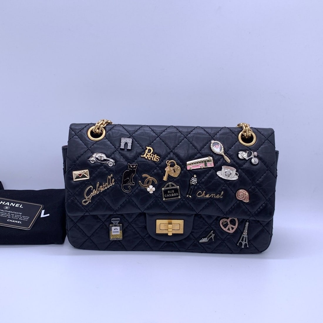 Chanel 2.55 Reissue Lucky Charms Flap Bag Black Aged Calfskin Limited: Normal signs of use: slight wear on the edges and corners, minor color touch-up inside, and scratches on the hardware.