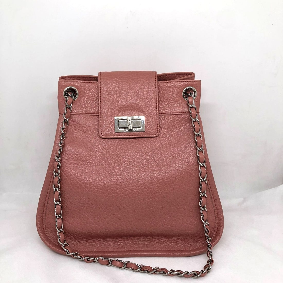 CHANEL Pink Grained Leather Reissue Mademoiselle Lock Drawstring Tote Bag Italy: Good, normal signs of use, inside is clean, body has imprints, hardware has scratches.