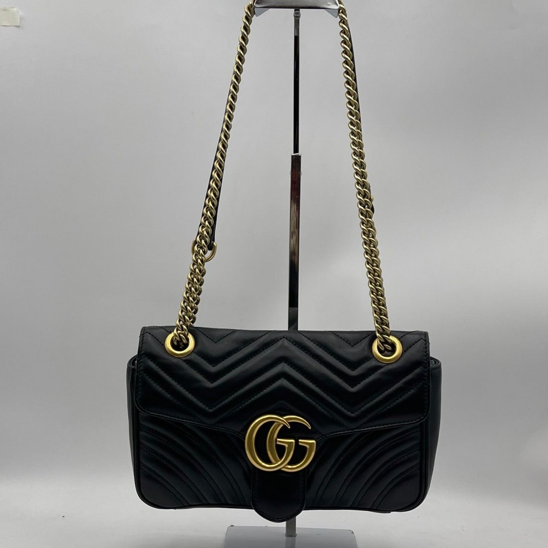Gucci GG Marmont Shoulder Bag Black Leather handbag Origin Italy: The condition is average, with traces of normal use, stains inside, hardware scratches, and leather scratches