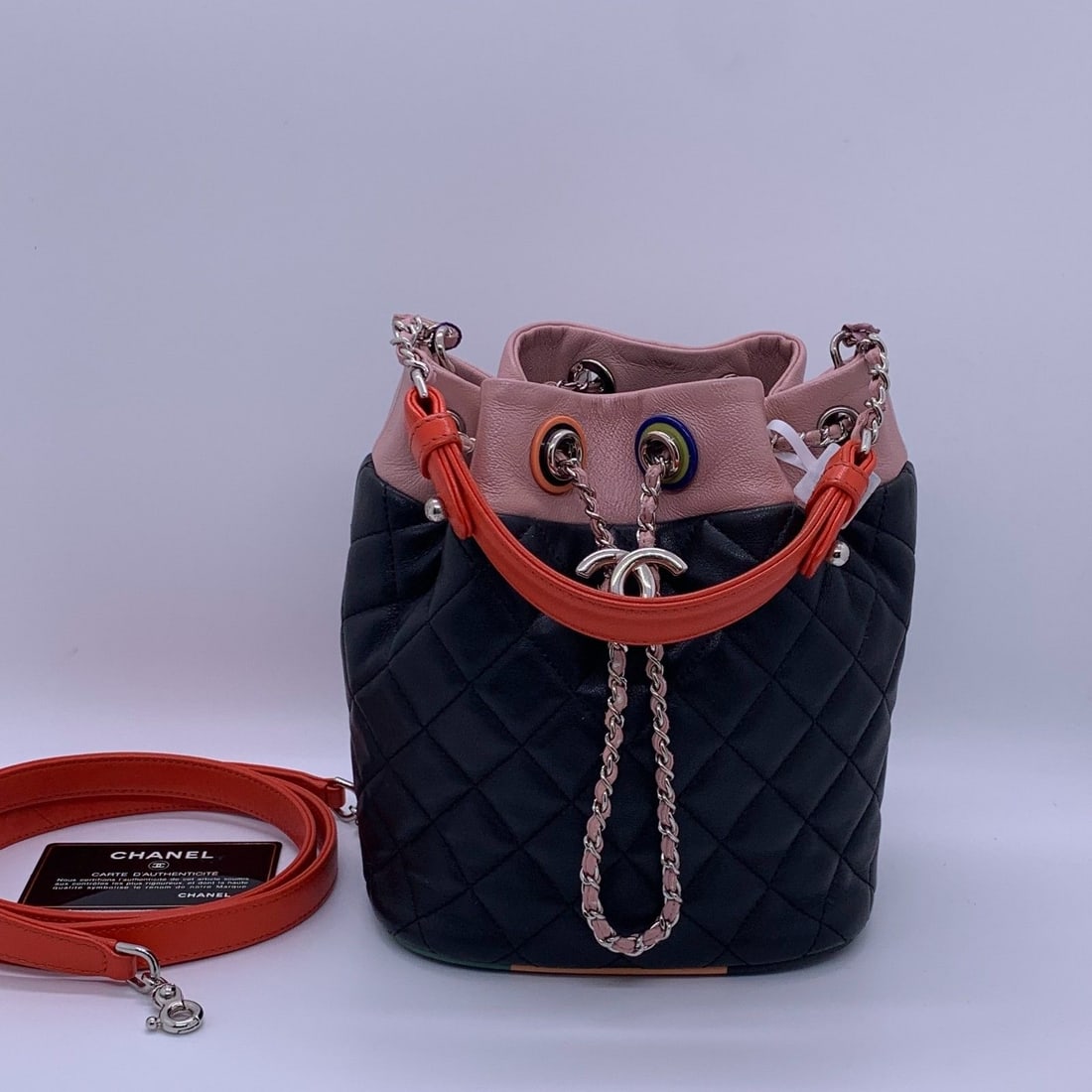 Authentic Chanel Cuba Drawstring Bucket Bag Quilted Lambskin Black Pink 2-Way: Normal signs of wear: slight darkening and wear on the edge chain, scuffs on the four corners, stains inside, and scratches on the hardware.