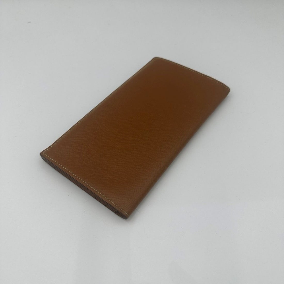 Hermes camel Epsom Leather long Wallet Origin France: The condition is average, with obvious signs of use