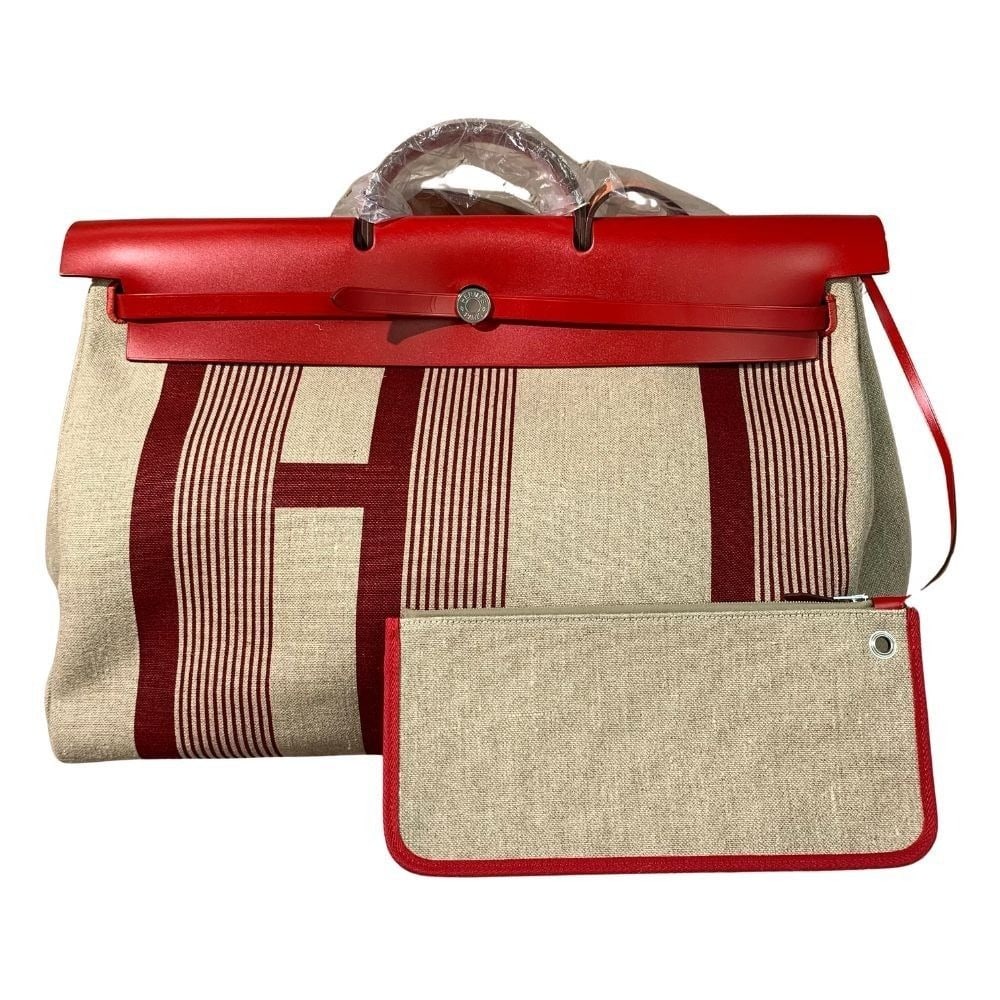 Hermes Toile H Vibration Herbag Zip Cabine Retourne 50 travel bag Stamp D France: Normal signs of use, worn corners, scratches on metal hardware, and clean interior.