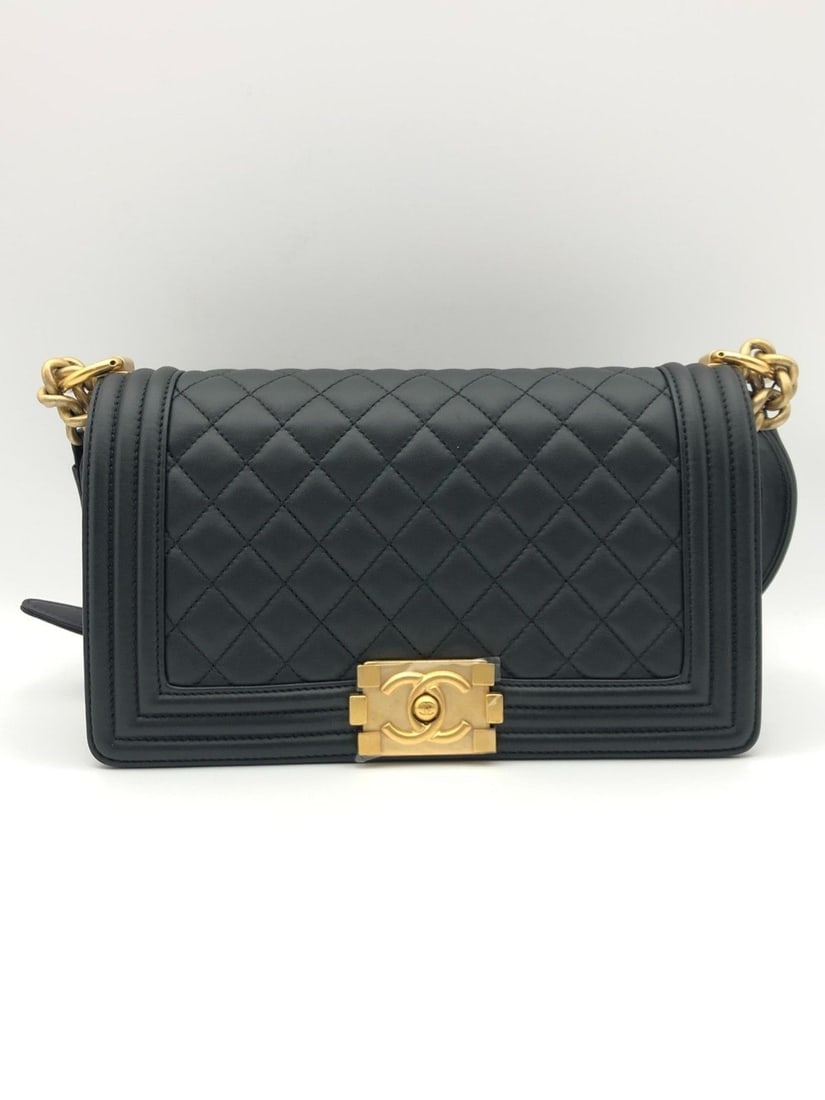 Chanel Medium Boy Flap Bag Black Quilted Leather Gold Hardware Chip: Normal signs of wear, minor scratches on hardware, chain wear, and clean interior.