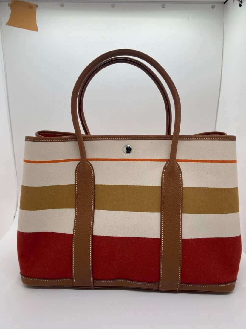 Hermes Garden Party 36 Tote Bag Toile and Negonda Striped Stmap Q: Normal signs of use, corner wear, handle wear, scratches on hardware, clean interior.