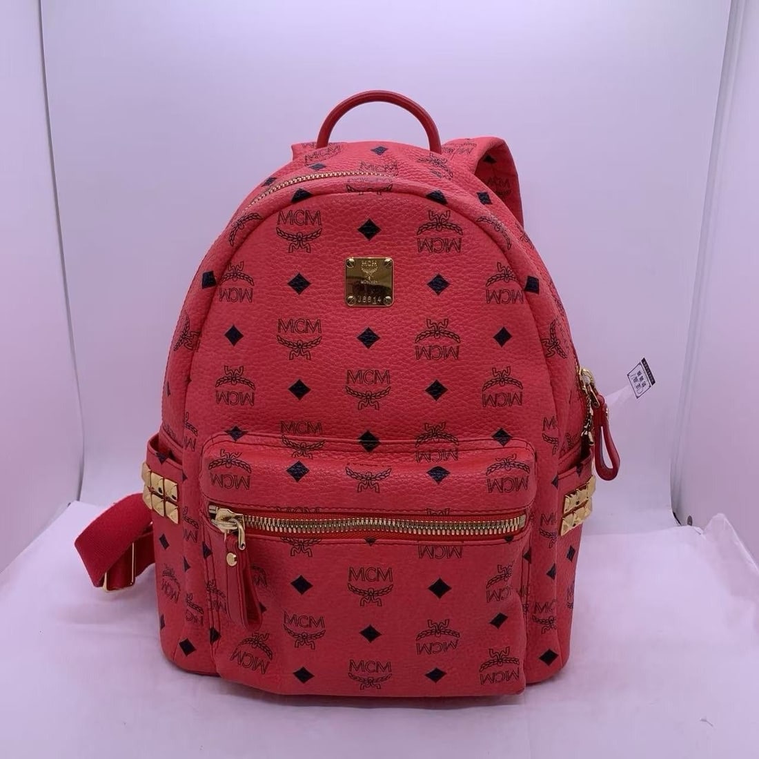 MCM Stark Side Studs Backpack Visetos Monogram Candy Red South Korea: Normal signs of daily use