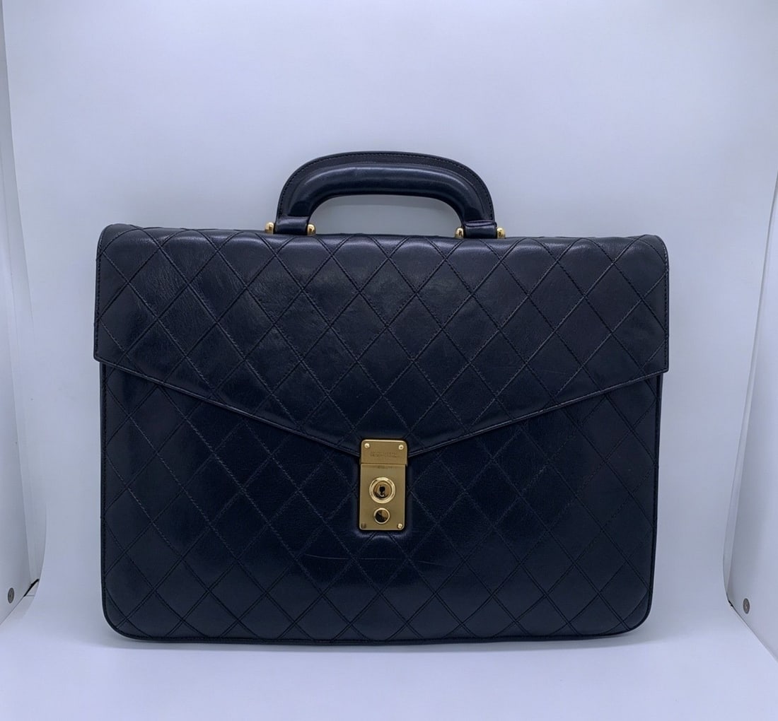 Chanel Vintage Black Quilted Lambskin Briefcase Business Bag Gold HW Authentic: Condition: Obvious signs of wear, corner abrasion, scratches and fading on metal hardware.Accessories: No Accessoriessize: Width:38cm,height:29cm