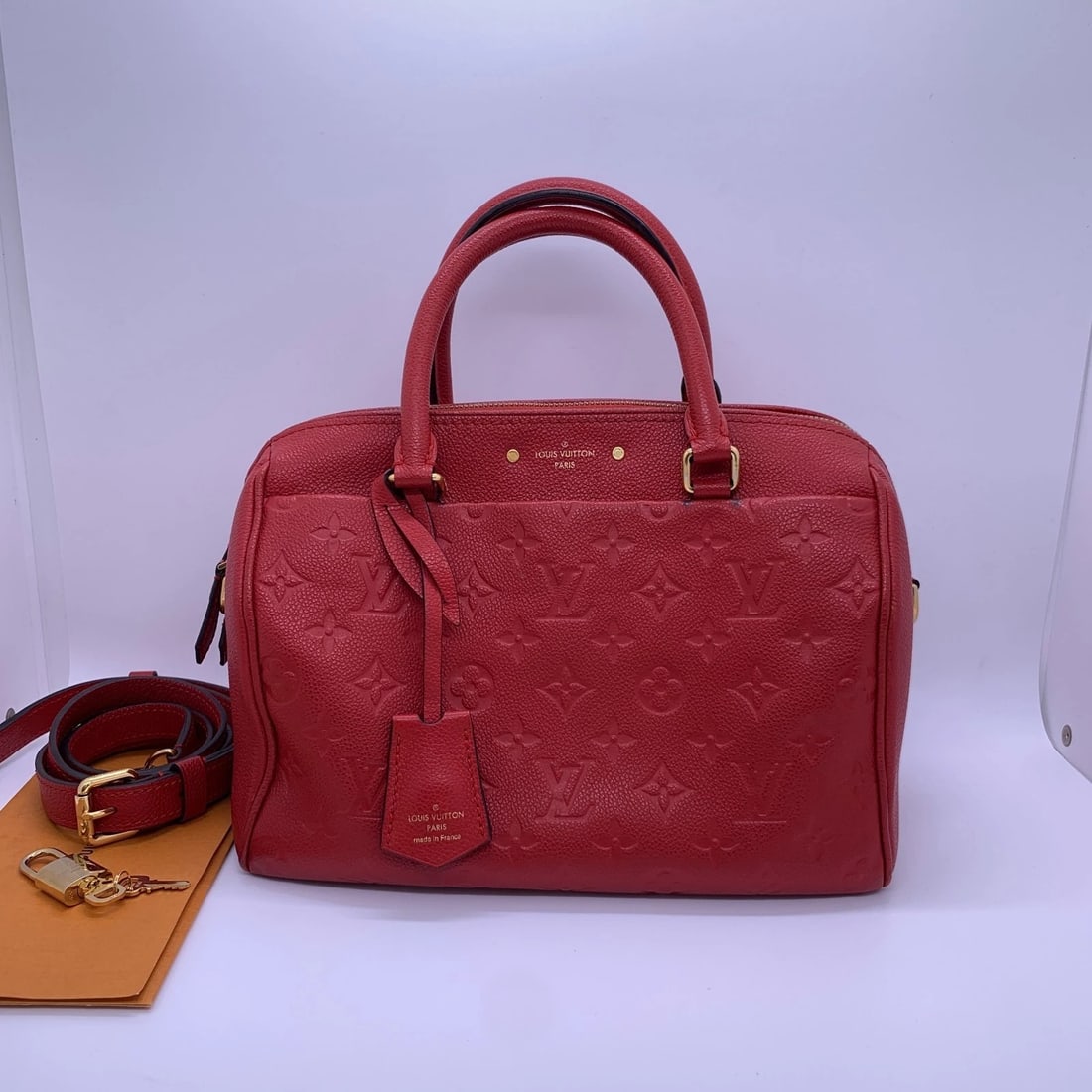 Louis Vuitton Speedy 25 Bandouliere Red Leather Crossbody Shoulder Bag: Condition:Normal signs of use, clean interior, scratches on hardware, and wear on the four corners.Accessories: shoulder strap, lock, keysize: long:25cm,height:20cmDesigner: Louis VuittonModel: Speedy
