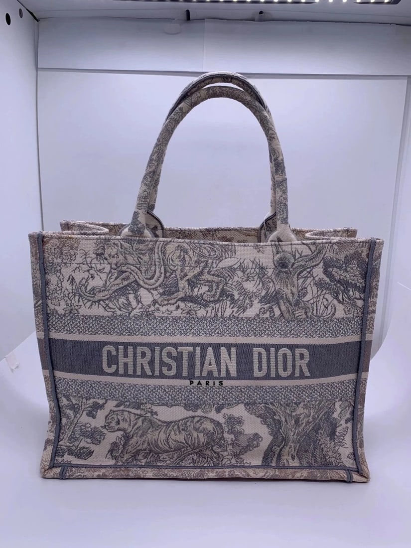 Christian Dior Medium Book Tote Gray Toile de Jouy Embroidered Bag: Condition: Good,Normal signs of use, corner wear, and stains both inside and outside.Accessories: No Accessoriessize: Width:10cm,height:8cmDesigner: Christian DiorModel:Book Tote MediumExterior Materi