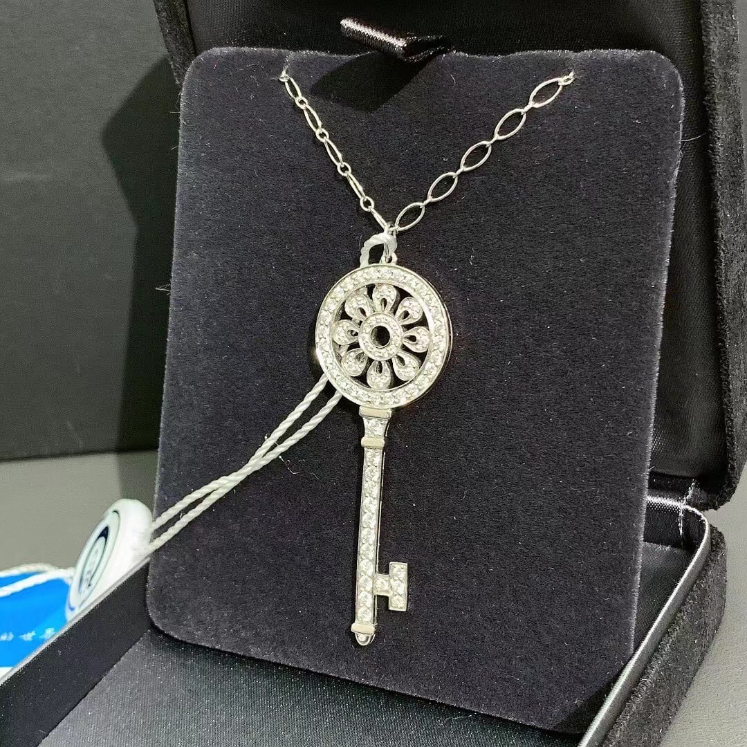 Tiffany & Co. Platinum Large Full Diamond Sunflower Key Necklace: Metal: PlatinumDimensions: Height: 2.13 in (54 mm)Width: 0.83 in (21 mm)Place of Origin: United StatesPeriod: 2010-Date of Manufacture: UnknownCondition: Excellent. In original box.